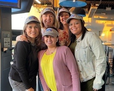 women of Wen-Parker Logistics wearing branded visors