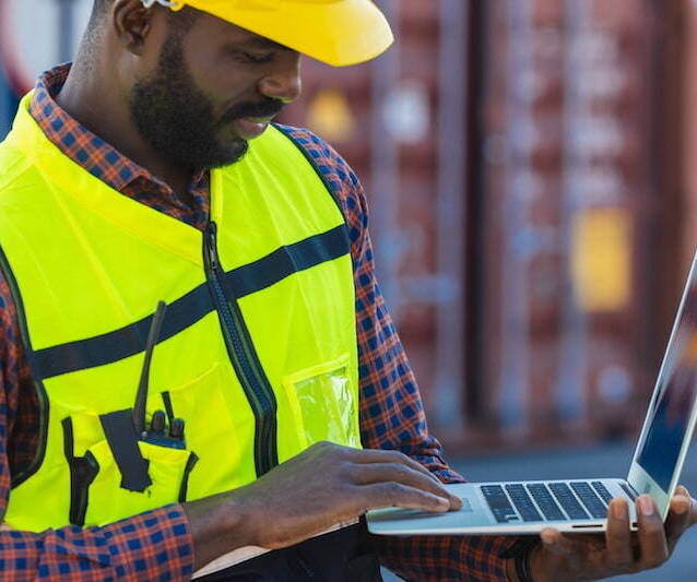 Logistics worker filing customs entries at port