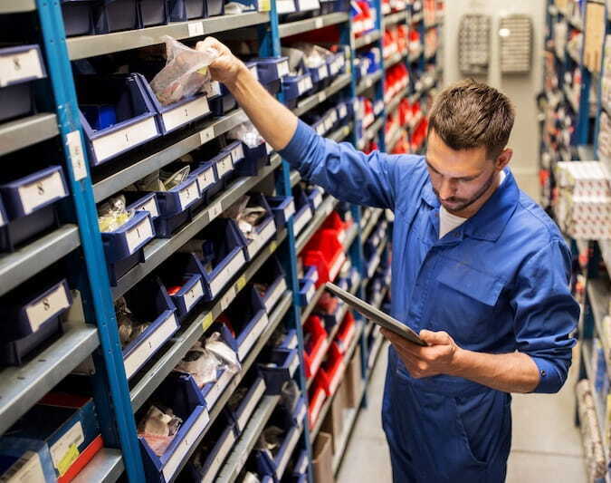 Worker using tablet to streamline pick and pack services