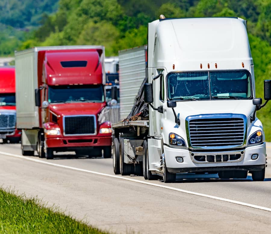 Trucks transporting cargo on highway